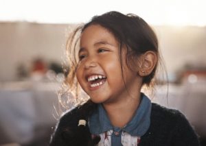 Smiling young girl at home